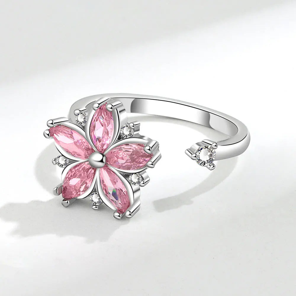 Bague ajustable avec fleur rotative anti-stress en cristaux roses