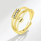 Ring mit drehbaren Perlen gegen Angst für Damen Gold
