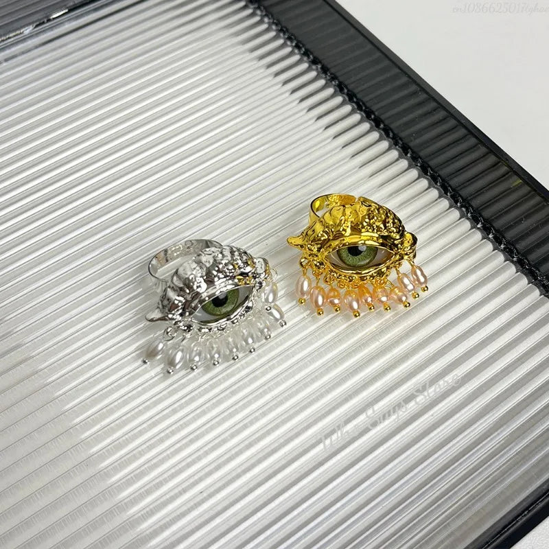 Schutzring mit blauem Auge und goldenen Perlen