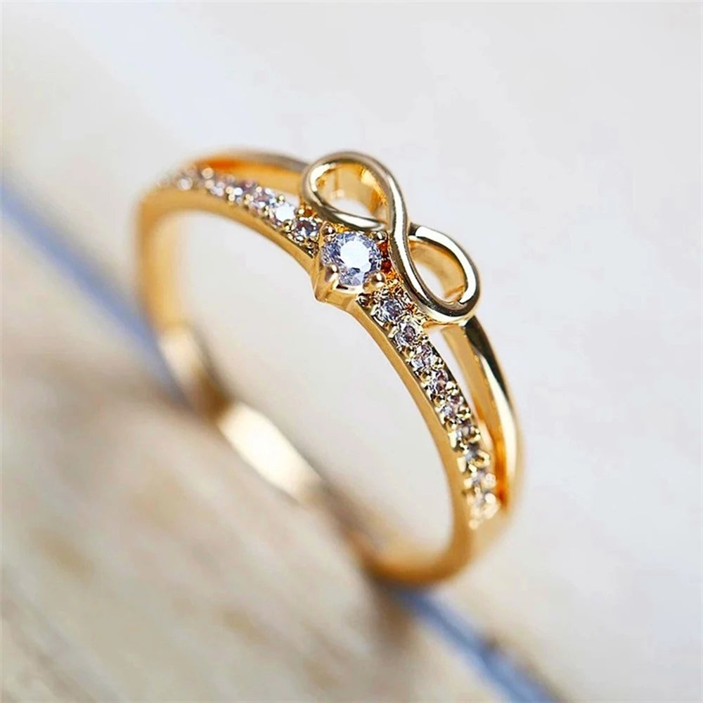 Doppelring mit Unendlichkeitssymbol aus Gold