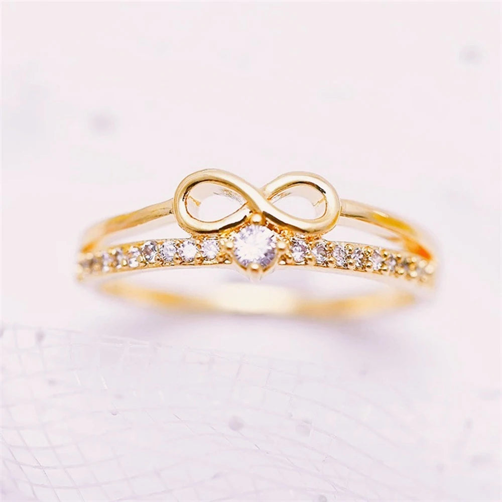 Doppelring mit Unendlichkeitssymbol aus Gold
