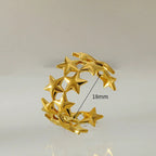 Breiter Ring mit mehreren Sternen aus Gold