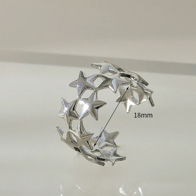 Breiter Ring mit mehreren Sternen aus Silber
