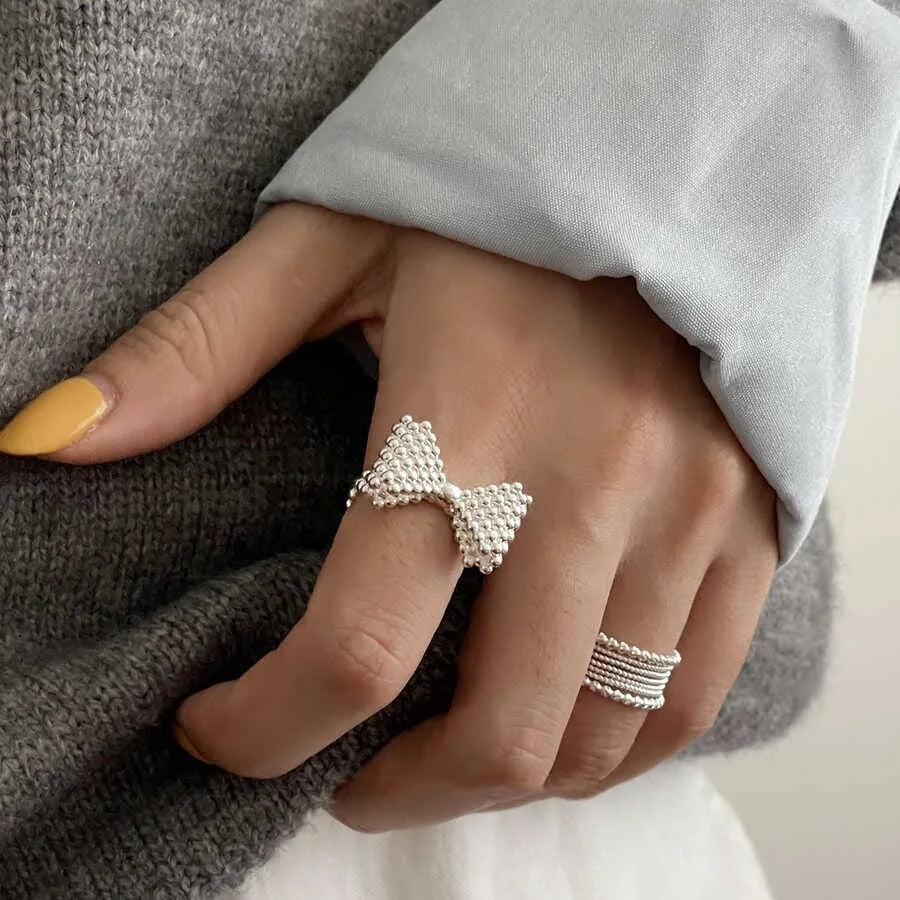 Fliege- und Perlenring