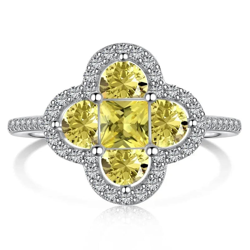 Leuchtender Kleeblatt-Ring aus Kristallen in Silber und Gelb
