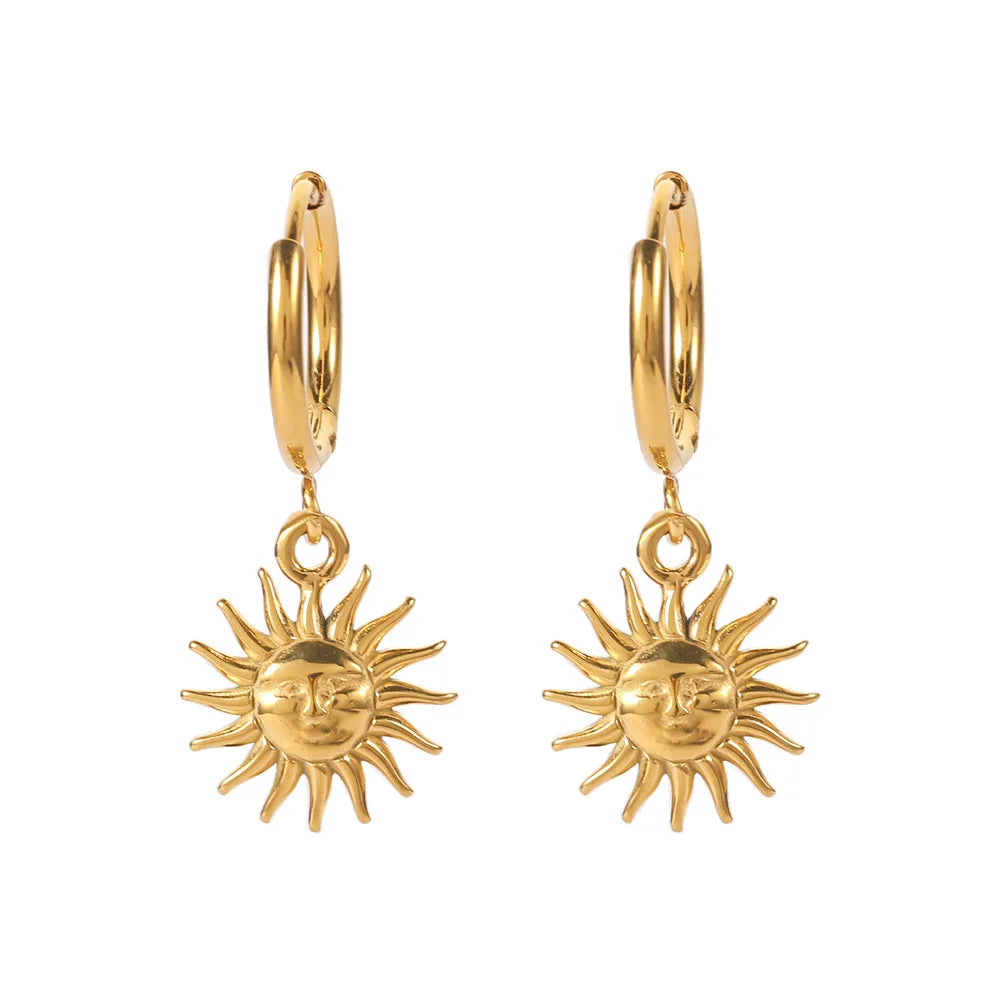 Boucles d'oreilles créoles avec pendentif soleil visage