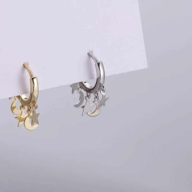 Creolen-Ohrringe mit hängenden Sternen und Monden in Silber