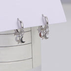 Creolen-Ohrringe mit hängenden Sternen und Monden in Silber