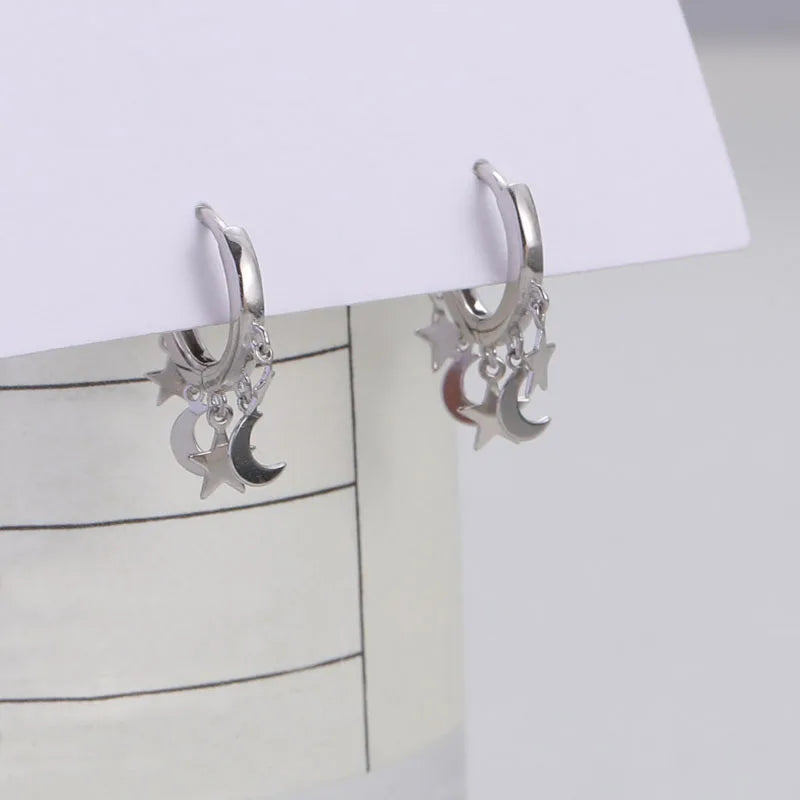 Creolen-Ohrringe mit hängenden Sternen und Monden in Silber