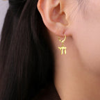 Hängende Ohrringe mit dem jüdischen Symbol Chai in Gold