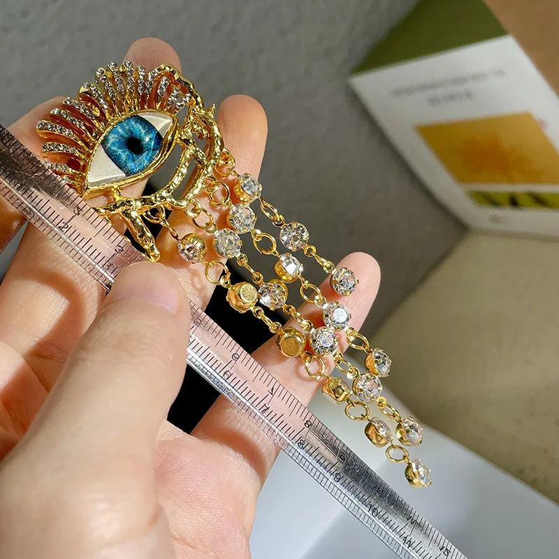 Hängende Ohrringe mit blauem Auge und Strass