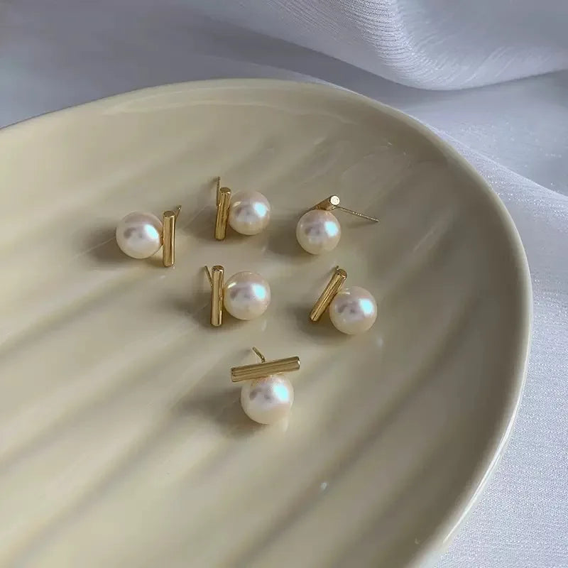 Perlenohrringe mit geometrischem Stab