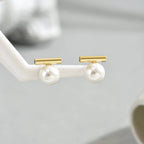 Perlenohrringe mit geometrischem Stab