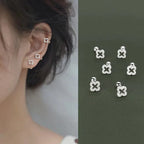Ohrstecker mit durchbrochenem Kleeblatt und Strass