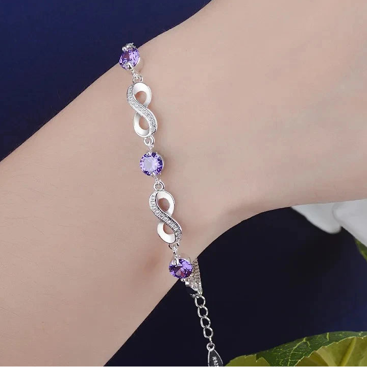 Armband mit violetten Perlen und Unendlichkeitszeichen, verziert mit Kristallen 