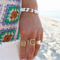 Armband mit Kaurischale und Perlen