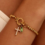 Armband mit Kreuz und Geburtsstein für Dezember