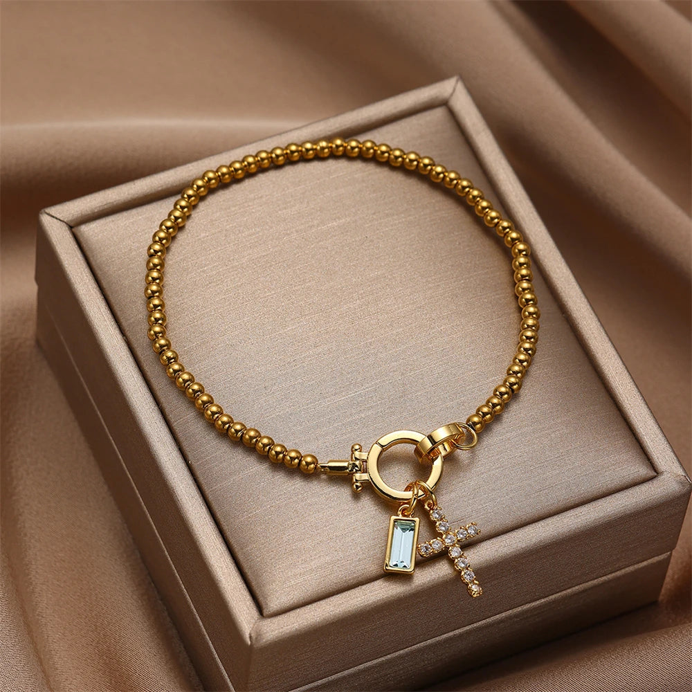 Armband mit Kreuz und Geburtsstein