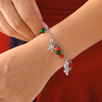 Armband mit Schneeflocken und Weihnachtskugeln