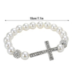 Armband mit weißen Perlen und Kreuz