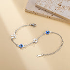 Armband mit Schutzsymbolen blaues Auge, Chai und dem <span data-glossary-id="davidstern">Davidstern</span> Silber