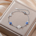 Armband mit Schutzsymbolen blaues Auge, Chai und dem <span data-glossary-id="davidstern">Davidstern</span> Silber