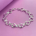 Armband mit Unendlichkeitszeichen in Herzform 