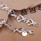 Armband mit Unendlichkeitszeichen in Herzform 