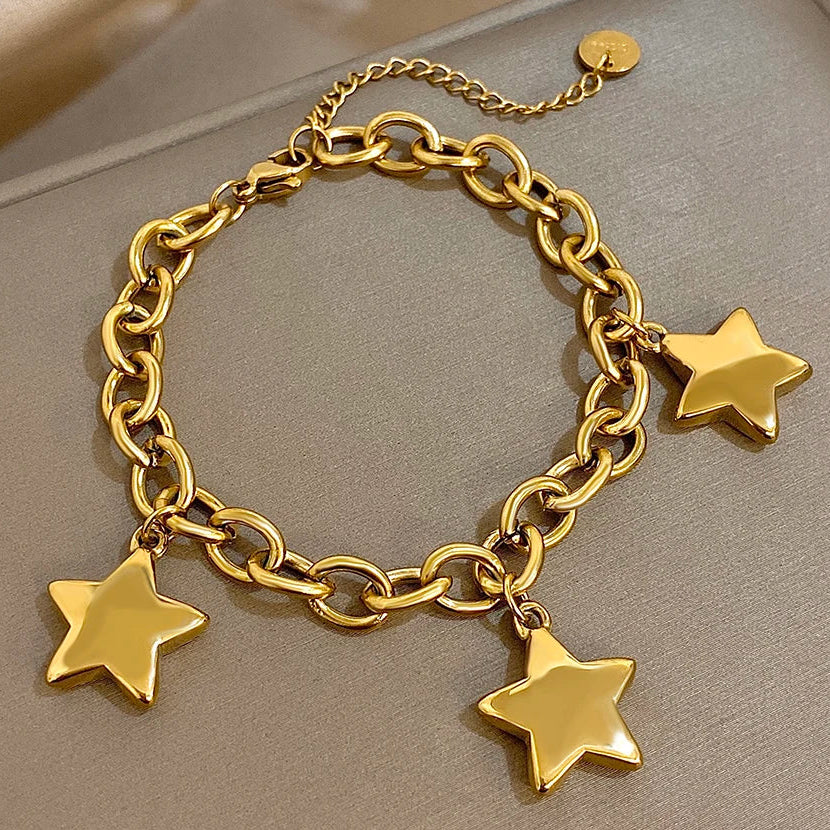 Armband mit drei hängenden Sternen Gold