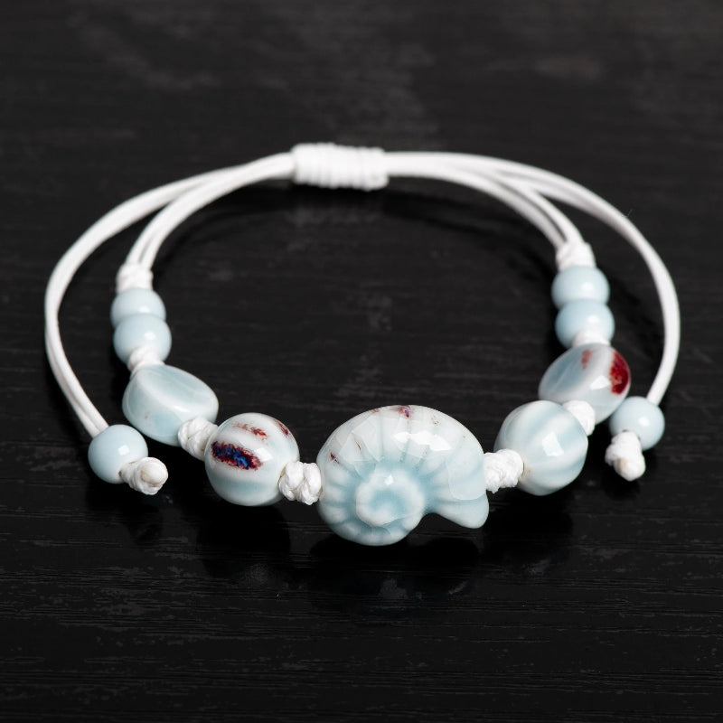 Boho-Armband Muschel Schnecke blau