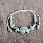 Boho-Armband Muschel Schnecke blau