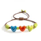 Armband mit Herz aus orangefarbener Keramik