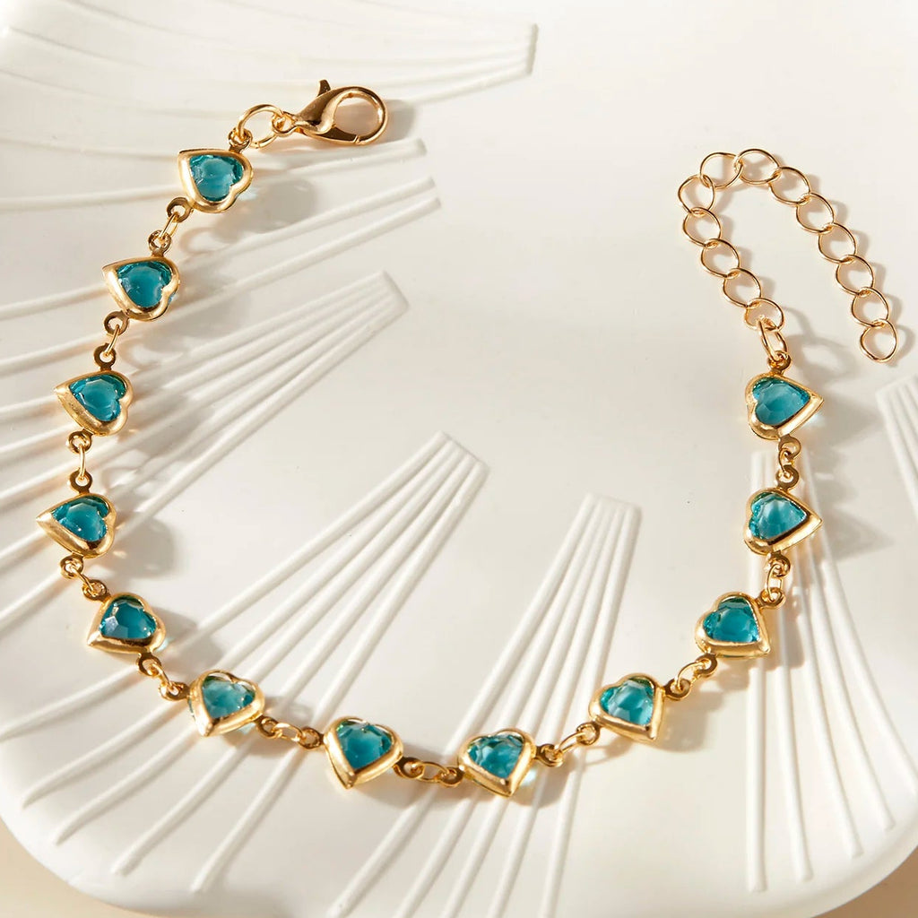 Armband mit emaillierten Herzen in Gold und Grün