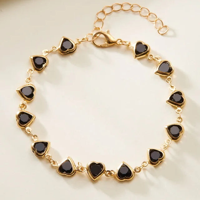 Armband mit emaillierten Herzen in Gold und Schwarz