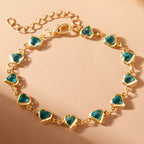 Armband mit emaillierten Herzen in Gold und Grün
