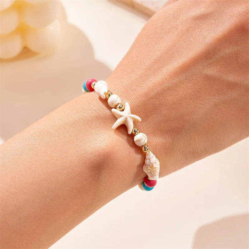 Kordelarmband mit Muschel und rotem Seestern-Stern