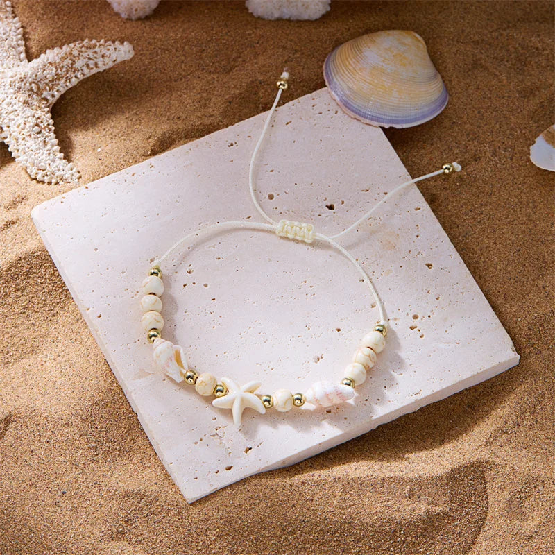Kordelarmband mit Muschel und weißem Seestern-Stern