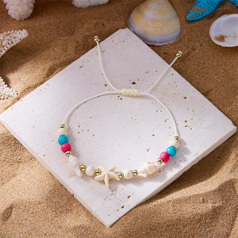 Kordelarmband mit Muschel und weißem Seestern-Stern