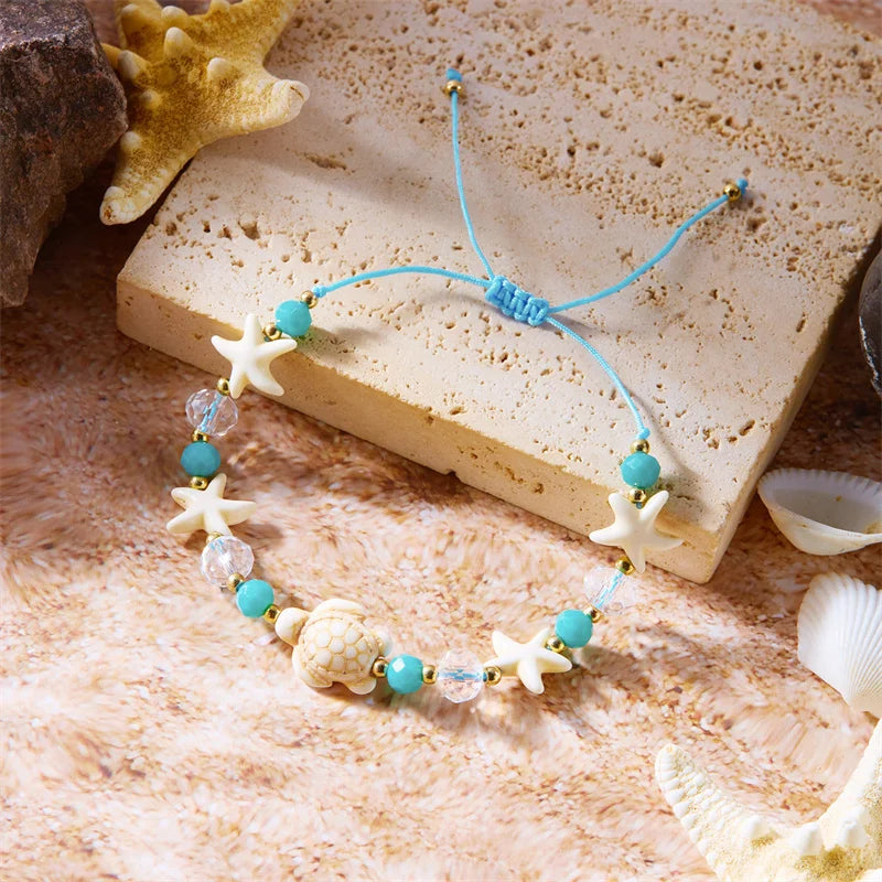Kordelarmband mit Muschel und blauem Seestern-Schildkröte