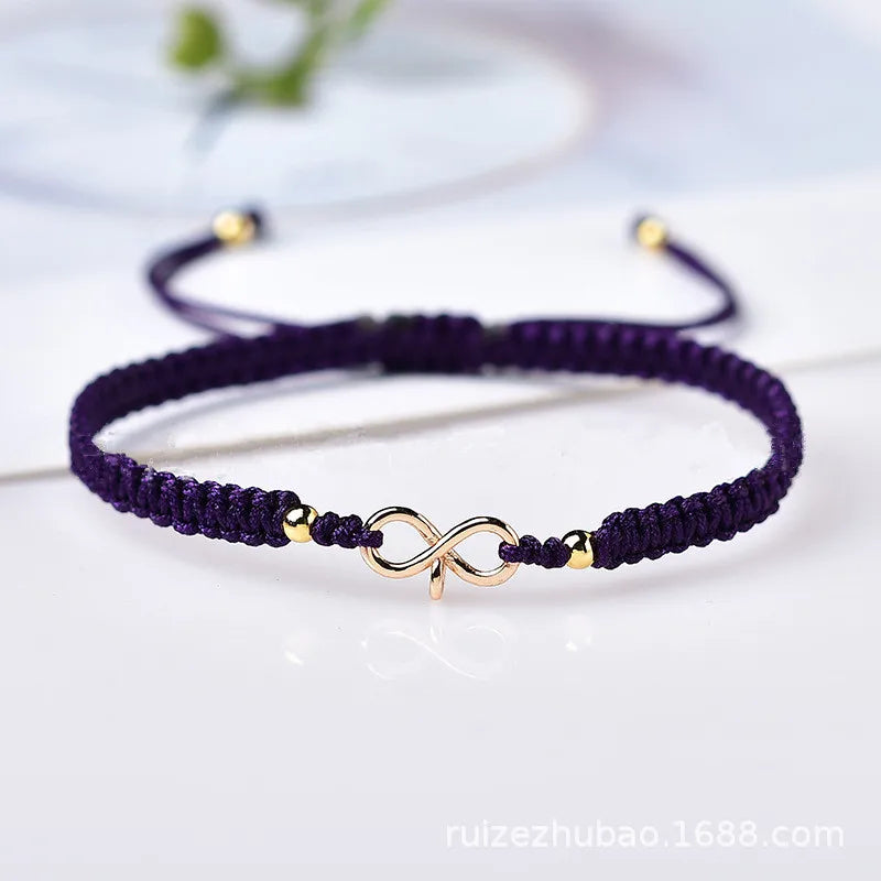 Bracciale con cordoncino intrecciato e simbolo infinito portafortuna viola