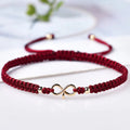 Bracciale con cordoncino intrecciato e simbolo infinito portafortuna bordeaux