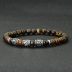 Buddhistisches Schutzarmband aus Tigeraugenperlen und gravierten Mantras