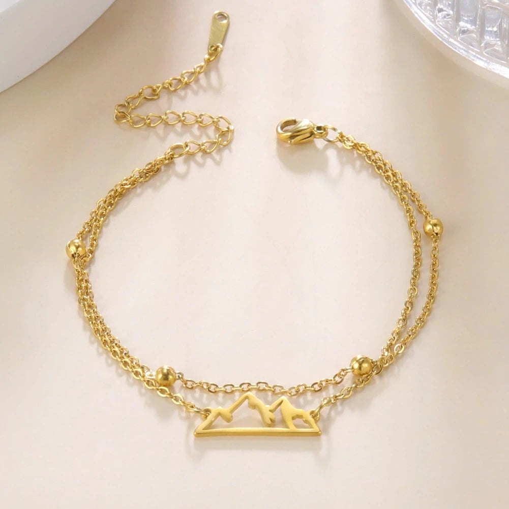 Doppelarmband mit Berganhänger gold