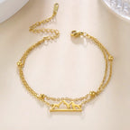 Doppelarmband mit Berganhänger gold