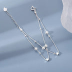 Doppelreihiges Armband mit Sternen und sandgestrahlten Perlen