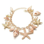Elegantes Armband mit goldenen Muscheln