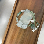 Seilarmband mit Perlen und Lotusblume