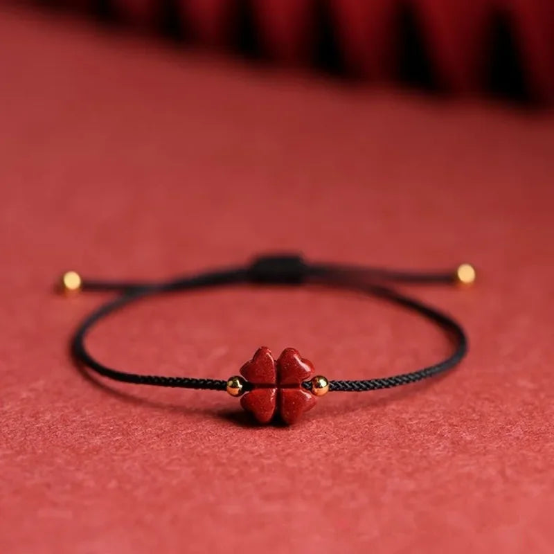 Seilarmband mit vierblättrigem Kleeblatt aus schwarzem Zinnoberstein