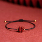 Seilarmband mit vierblättrigem Kleeblatt aus schwarzem Zinnoberstein