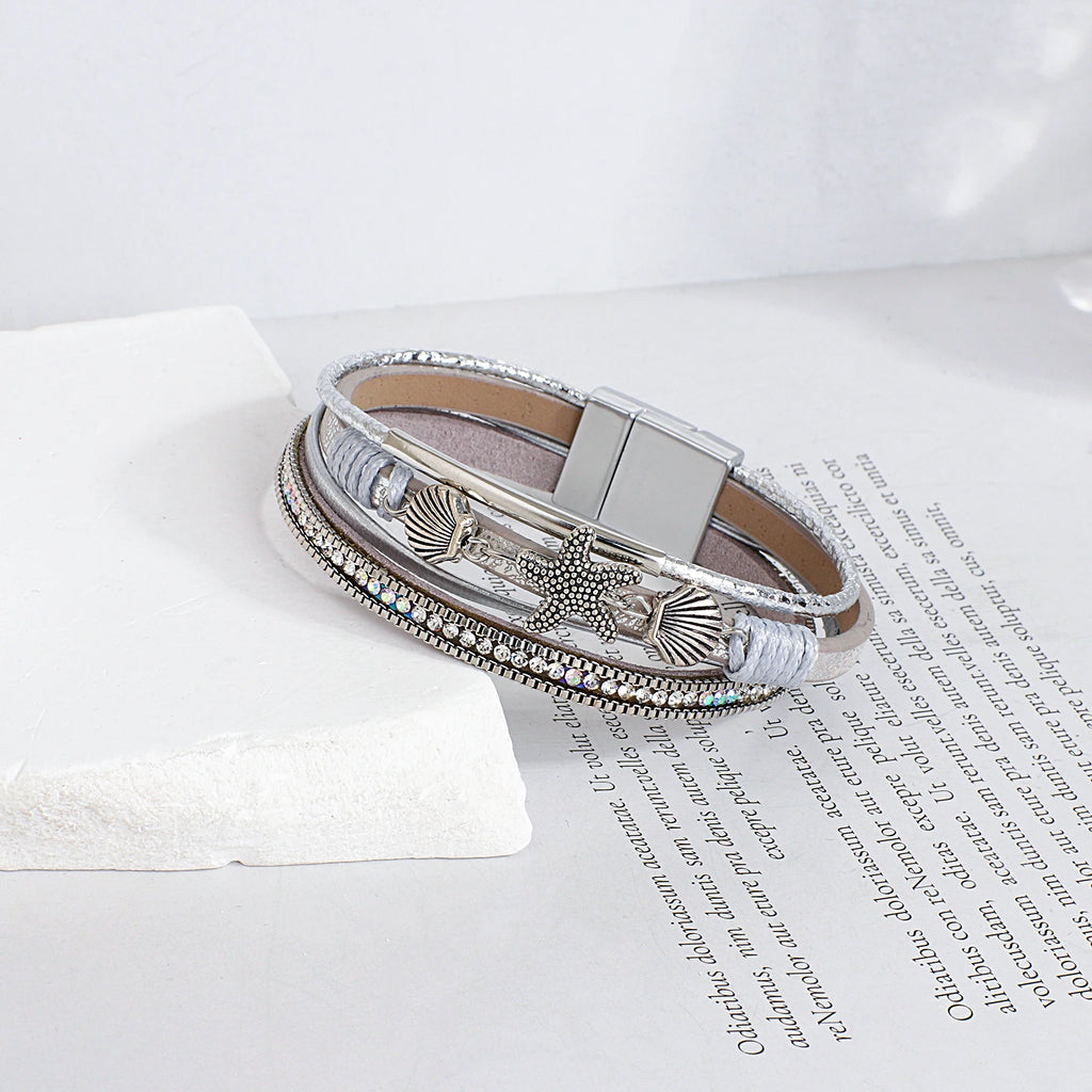 Armband aus Leder mit Muschel und Seestern in Silber